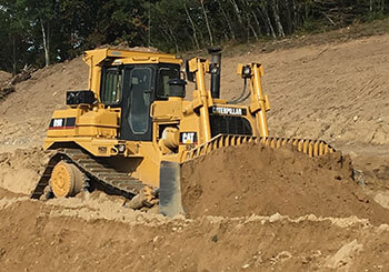 Bull Dozer pushing gravel